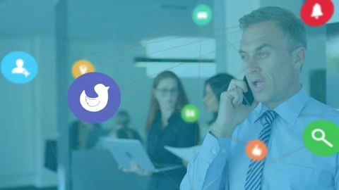 Manager on phone handling work call in office, alerts causing floating app icons Vidéo 332296600