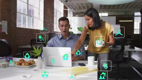 Manager pointing and tapping laptop, initiating green finance icons multiplying, Vidéo 331270204