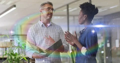 Manager pointing at folder initiating rainbow flares rising in business, woman Stock Footage 320586124