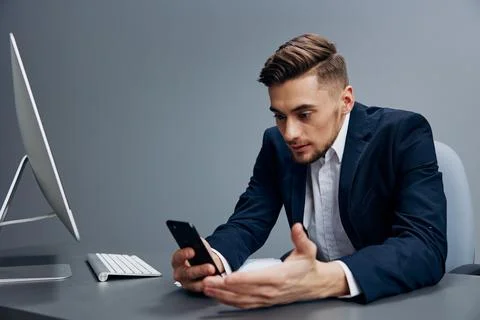 Manager problems at work sitting at a desk in front of a computer technologies Stock Photos