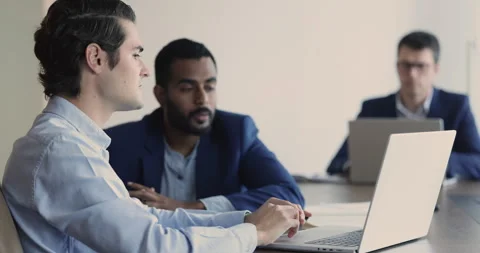 Manager provides information, makes presentation on laptop talking to client Stock Footage 252192246