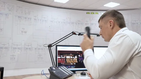 Manager of railway network in control center room of trains makes paper work. Stock Footage 114500406