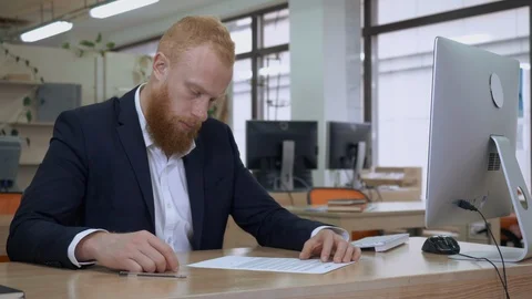 Manager reading document and writing signature Stock Footage 112096410