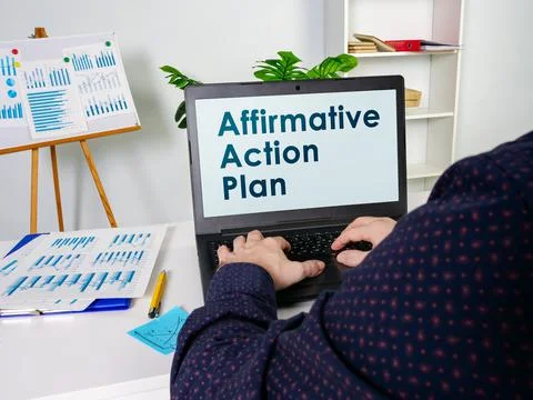 Manager reads about Affirmative Action Plan AAP. Stock Photos