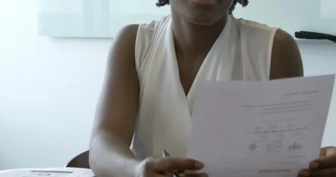 Manager Reads Resume for Interview Stock Footage 112759241