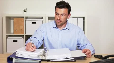 Manager receiving call in office Video stock 11134881