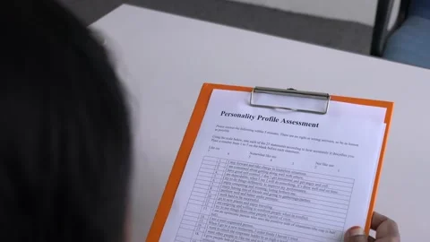 Manager reviewing performance evaluation form attached on a clipboard. Stock Footage 144312945