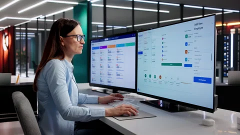 Manager Reviews Payroll Software On Computer 스톡 동영상 331160690