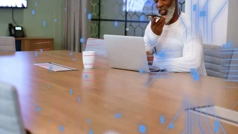 Manager right end table, typing laptop and speaking phone as tech overlays Stock Footage 333169365