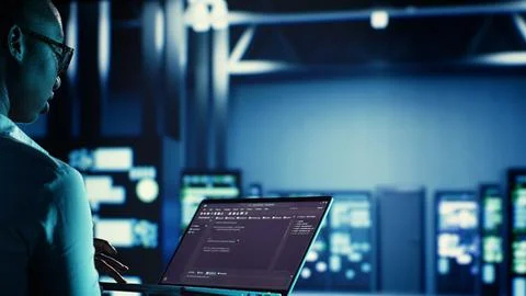 Manager runs code in data center 写真素材