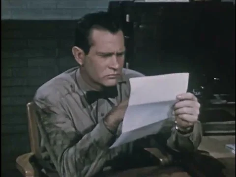 The manager of a service station looks over the application submitted to him byƒ Stock Footage 75284873