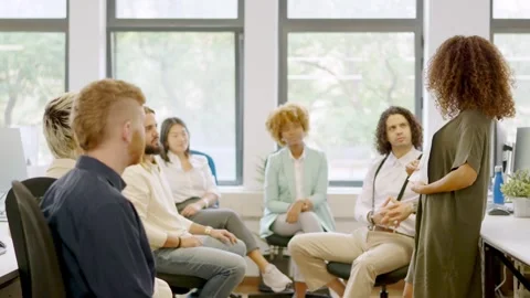 Manager showing data using graphics during a meeting Stock Footage 258220836