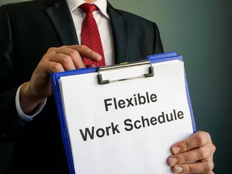 A manager shows Flexible Work Schedule in clipboard. Stock Photos