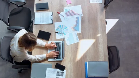 Manager sits at workplace with different documents Stock Footage 101467685