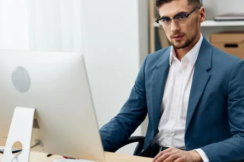 Manager sitting at the computer work boss technologies Stock Photos
