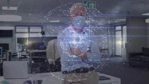 Manager sitting on desk, camera centering and activating tech globe over torso Stock Footage 333967973