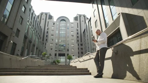 The manager solves business issues by texting on the phone. Stock Footage 205396159