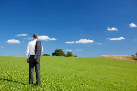 Manager standing under a blue sky Stock Photos