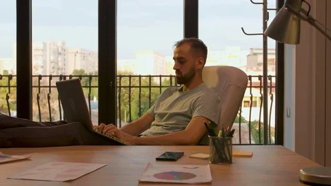 Manager of start up company working relaxed in sunset light Stock Footage 114314271