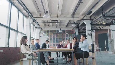 Manager start to dance on the table, sings into a megaphone, accelerates and Stock Footage 108675753