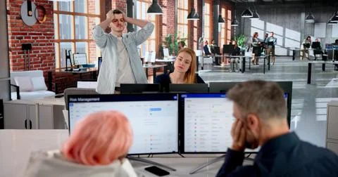 Manager Struggles To Guide Team Through Stressful Office Crisis Meeting. Stock Photos