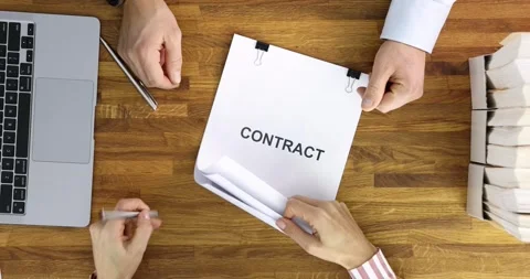 Manager submits work contract for signature slow motion 4k movie Stock Footage 252659688