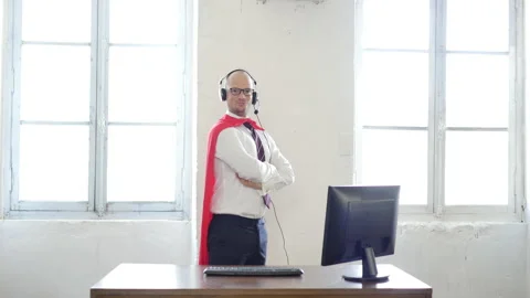 Manager in a superman pose wearing a red cloak. Businessman in a red superhero Stock Footage 143232778