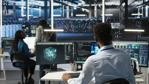 Manager supervising data center engineer using AI neural network models Stock Photos
