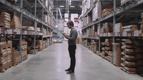 Manager With Tablet PC Checking Goods At Supermarket Warehouse. Modern Furniture 스톡 동영상 72028611