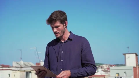 Manager with tablet, working on rooftop terrace, London, british handsome Stock Footage 140598493