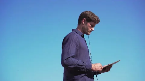 Manager with tablet, working on rooftop terrace, London, british handsome Stock Footage 140598592
