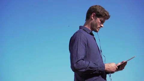 Manager with tablet, working on rooftop terrace, London, british handsome Stock Footage 144672144