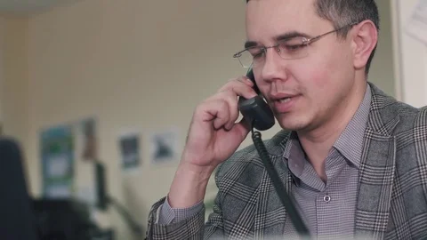 Manager talking to a customer on the phone. close-up Stock Footage 82089337