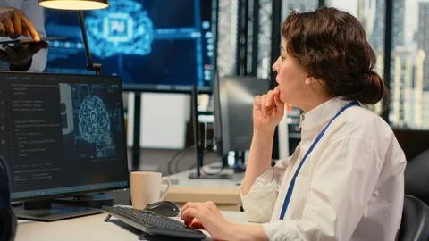 Manager talking with engineer in office automating workflows using AI Stock Photos