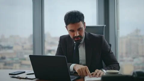 Manager talking online interview looking laptop camera in luxury office close up Stock Photos