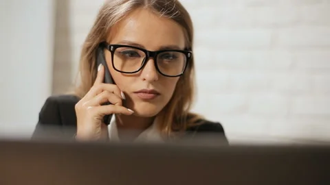 Manager Talks on Phone before Laptop 動画素材 92696687
