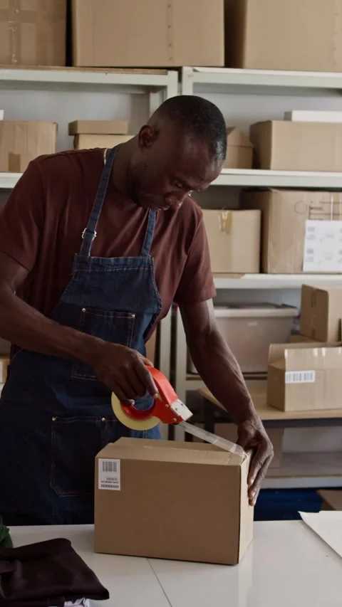 Manager Taping Box with Parcel at Warehouse Stock Footage 281916244
