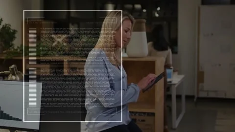 Manager tapping tablet screen triggers code overlay tracking business data Stock Footage 330725431