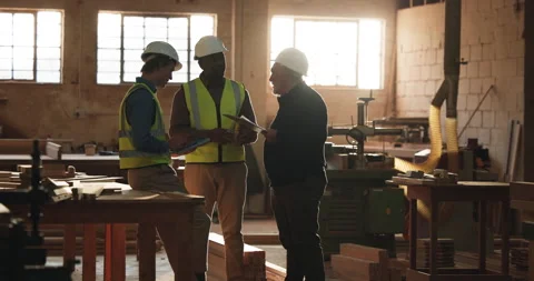 Manager, team and carpenter in workshop with tablet, clipboard and talk with Stock Footage 341377734