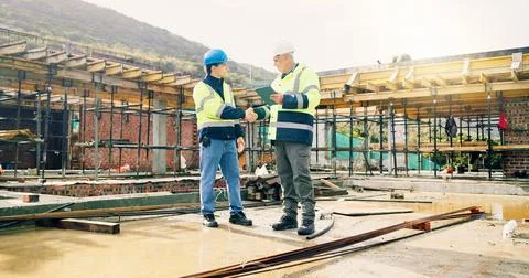 Manager, team and handshake on construction site with tablet, building outdoor Stock Photos
