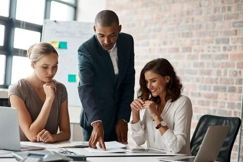Manager, team and paperwork in office for meeting, project brief and client.. Stock Photos