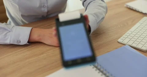 Manager using credit card reader in store Stock Footage 256333308