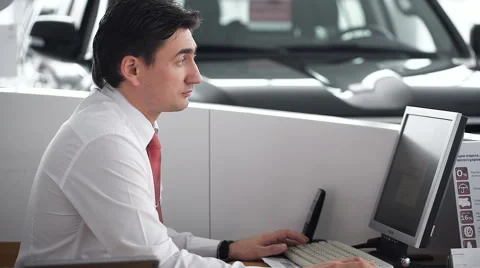 Manager using phone. Car showroom Stock Footage 60910532