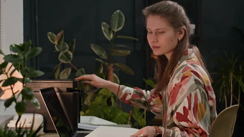 Manager Using Printer to Copy Papers when Sitting in front of Laptop at Office Stock Footage 302894547