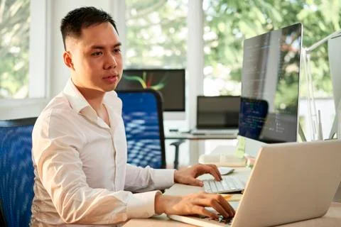 Manager using two computers in his work Stock Photos