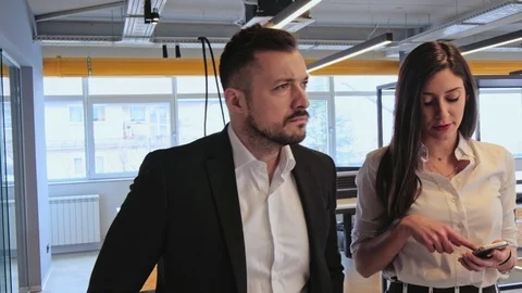 Manager walking and talking with his assistant Stock Footage 94837278