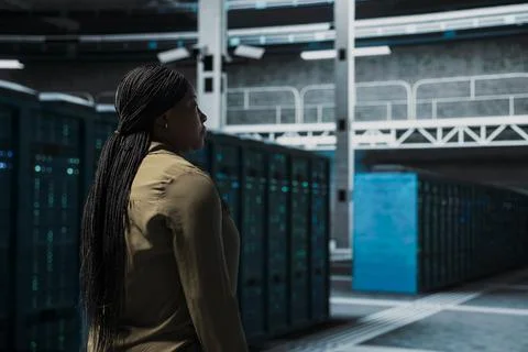Manager walking in data center with supercomputers supporting business needs 写真素材