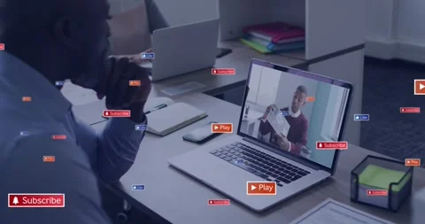 Manager watching laptop, play icon appearing and causing badges near viewer for Stock Footage 330936260