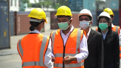 Manager wear face mask scanning body temperature and using hand sanitizer alc Stock Footage 154691478