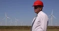 Manager Wearing Suit and a Hardhat Verify Wind Turbine Installations 4k or 4k+ Resolution